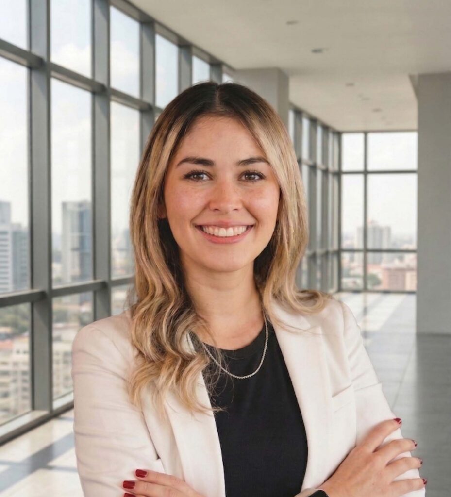 Sara Hueck professional headshot smiling with arms crossed in office setting